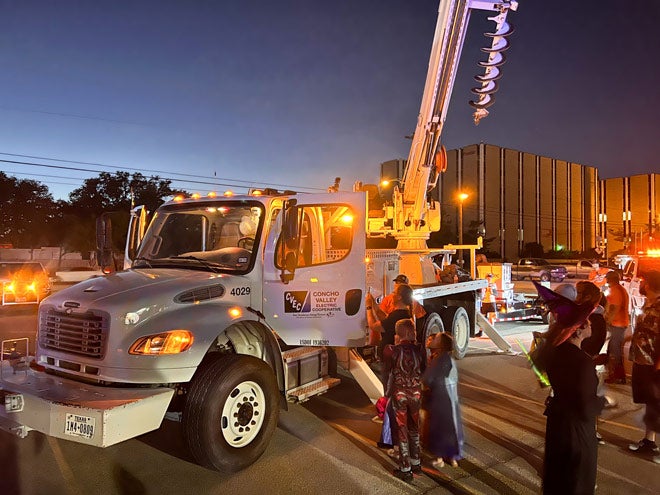 Attendees check out a bucket truck.